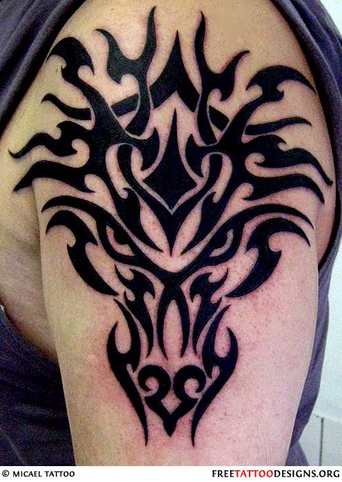 Tribal Dragon Head Tattoo On Men Shoulder