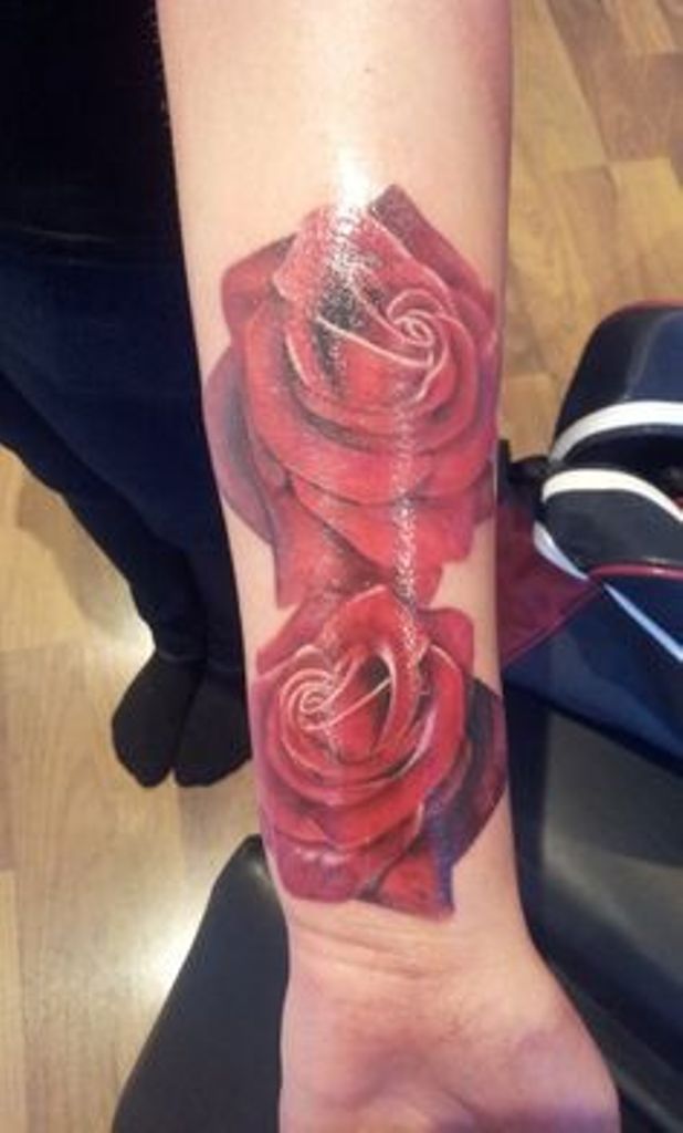 Two beautiful red roses wrist tattoo for women