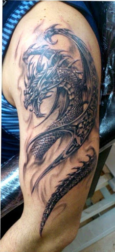Wonderful grey ink dragon tattoo on man half sleeve