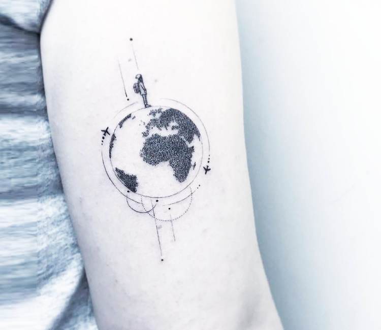 black and white shaded earth tattoo with airplane and child on arm by Eva Krbdk