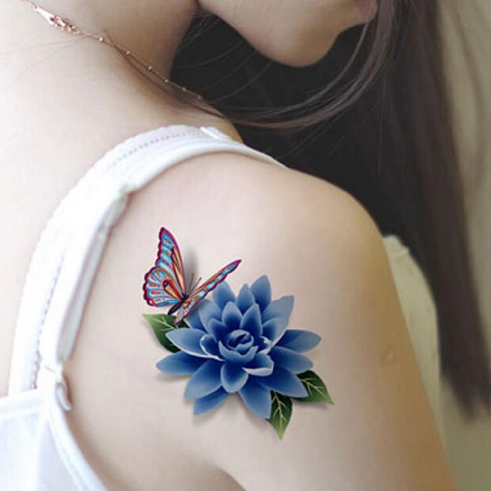Colorful butterfly and flower tattoo on right upper shoulder