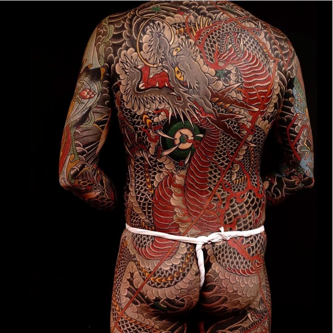 colorful traditional Japanese dragon tattoo on full body back part