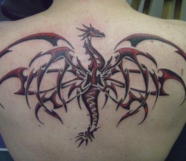 red and black dragon tattoo on the upper middle back