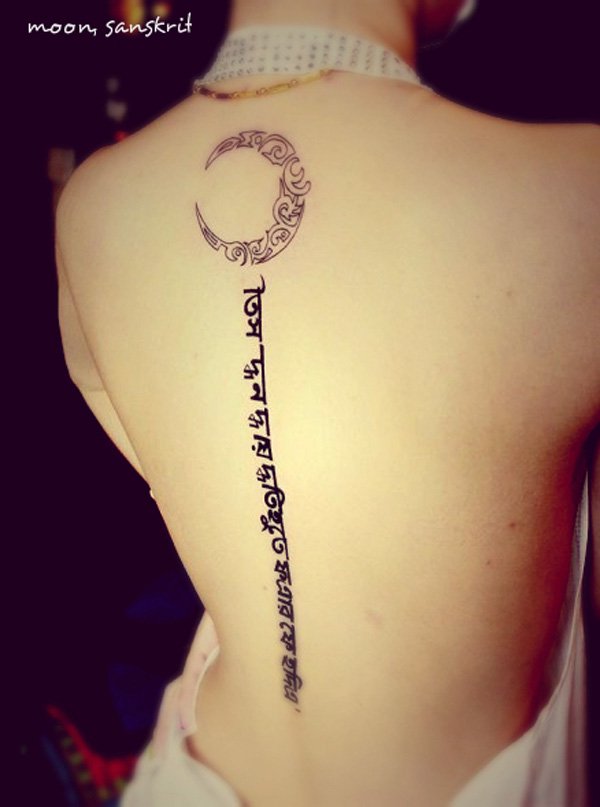 Black half moon tattoo design with text on full mid back for women