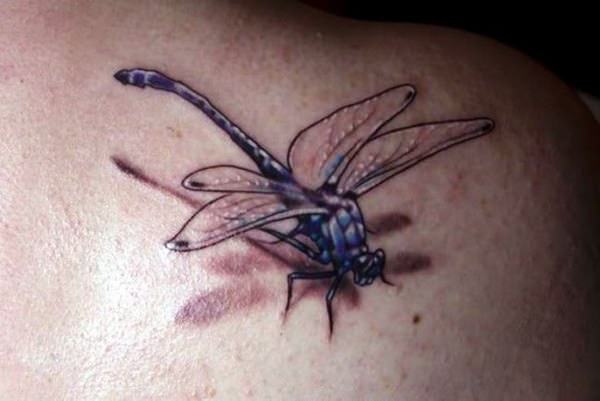 Black 3d dragonfly tattoo on body