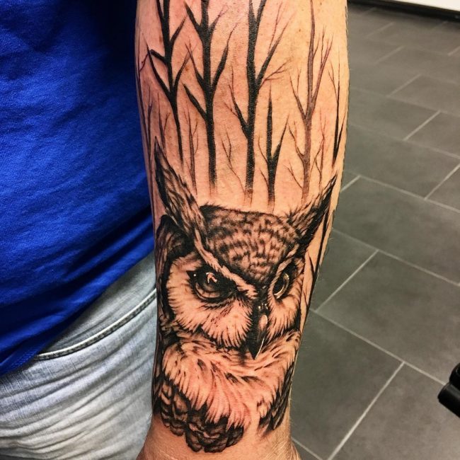 Black & White realistic owl tattoo on arm for men