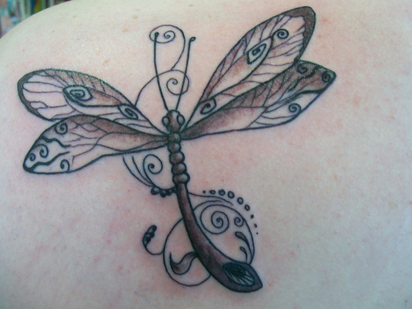 Black and brown designed dragonfly tattoo on back shoulder