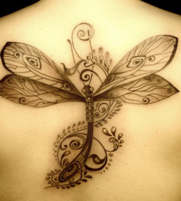 Black dragonfly tattoo design on upper back for women