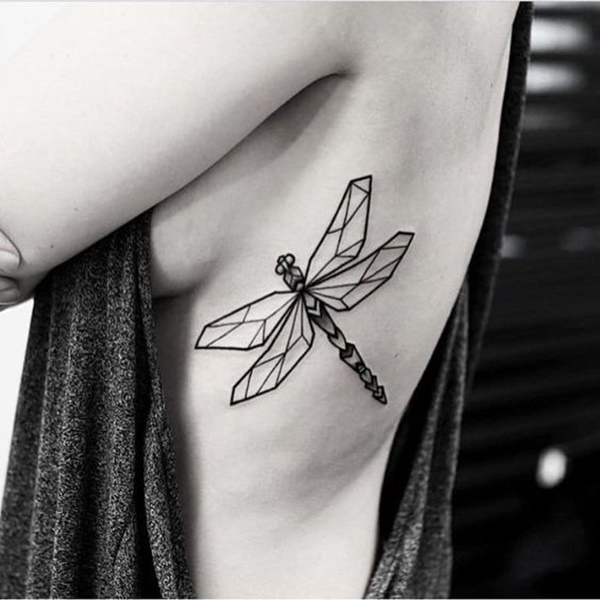 Black geometric designed dragonfly tattoo on girl siderib