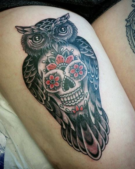 Black ink dark owl and sugar skull tattoo on girl thigh