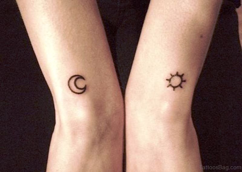 Black outlined tiny sun and moon tattoo on feet