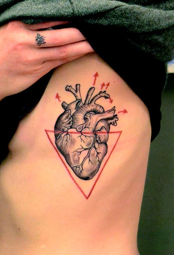 Black realistic heart tattoo with red triangle on siderib