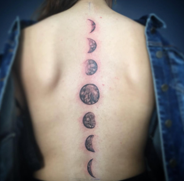 Black shaded lunar cycle moon tattoo on mid full back