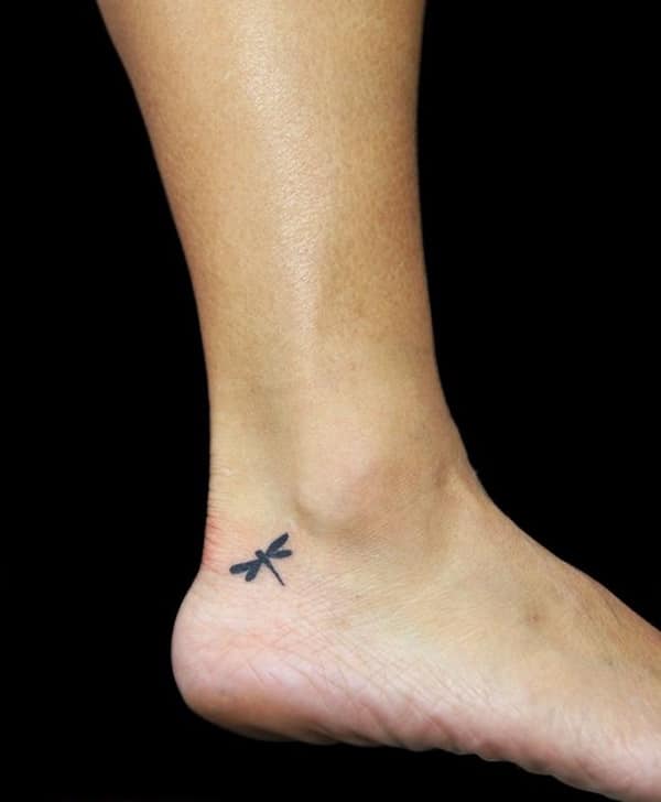 Black small dragonfly tattoo on right ankle for women