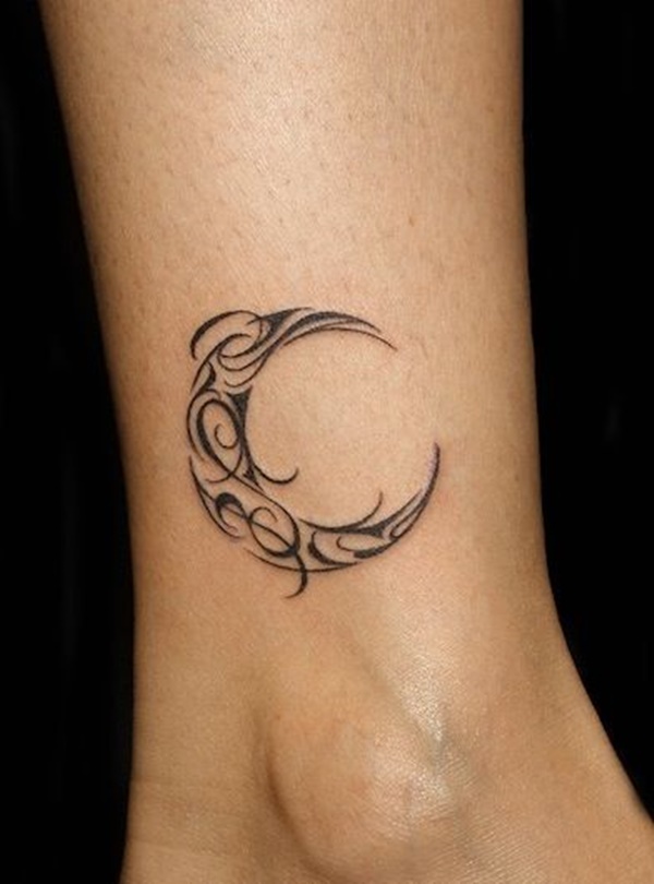 Black tribal half moon tattoo on right leg