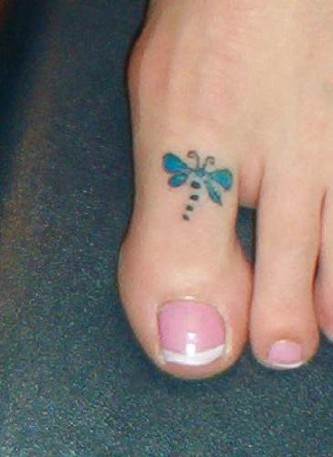 Blue small dragonfly tattoo on women toe