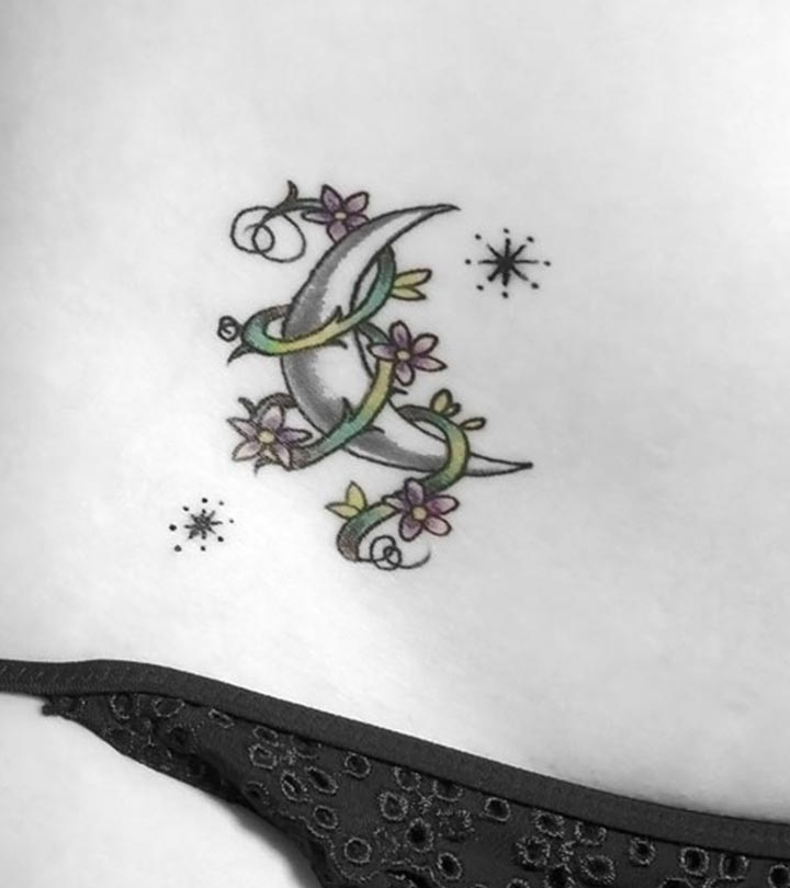 Colored half moon and flower tattoo on body
