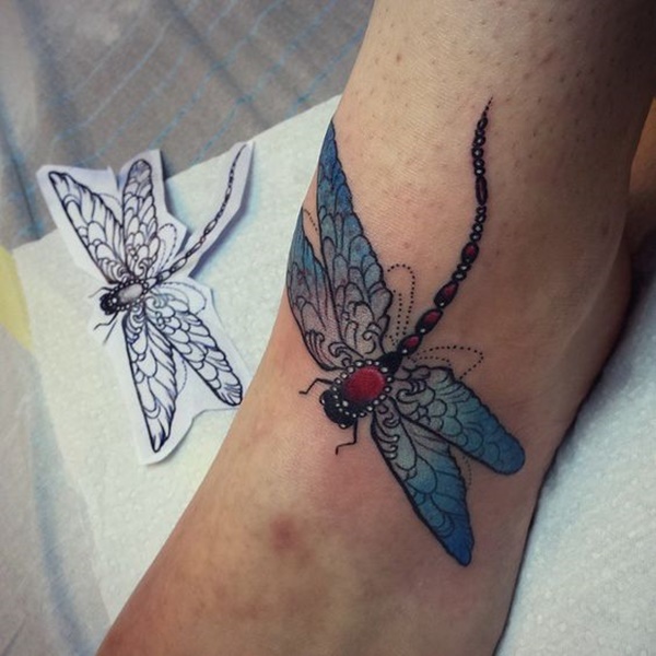 Colorful girly dragonfly tattoo on foot