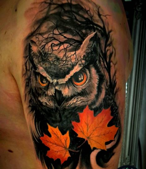 Dark realistic owl with maple leaves tattoo on man half sleeve