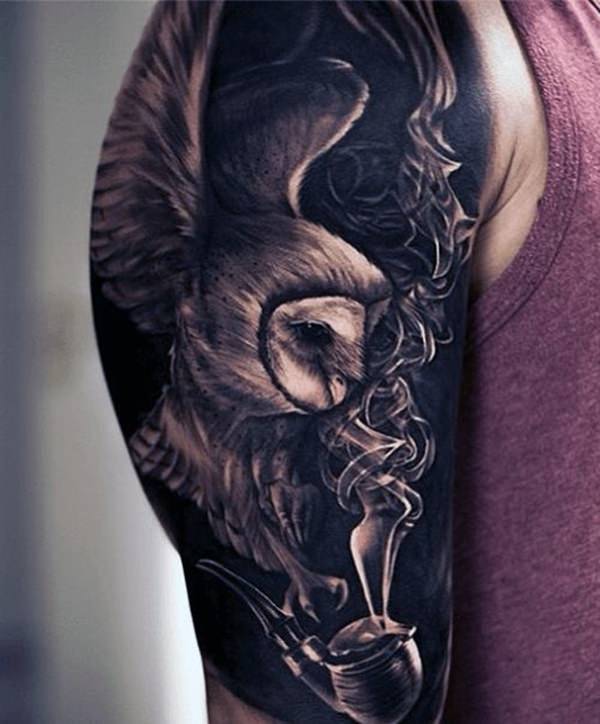 Flying barn owl and tobacco pipe tattoo with dark background on male half sleeve