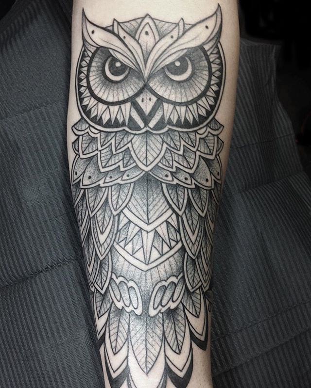 Magnificent grey ink owl tattoo on forearm