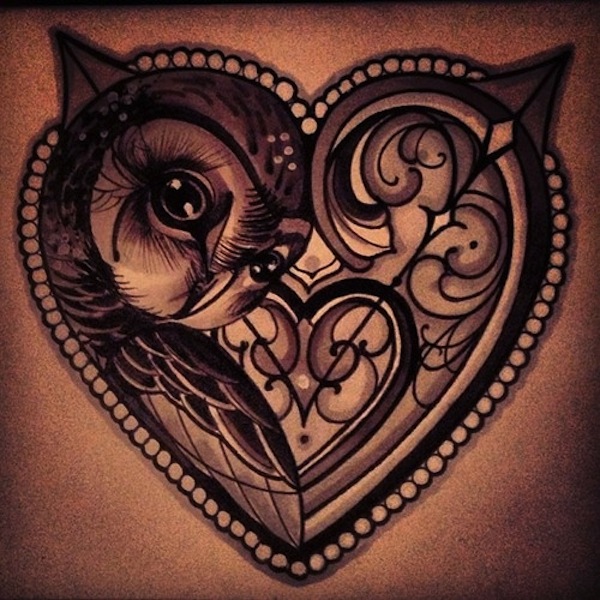 Owl in heart shaped frame tattoo design