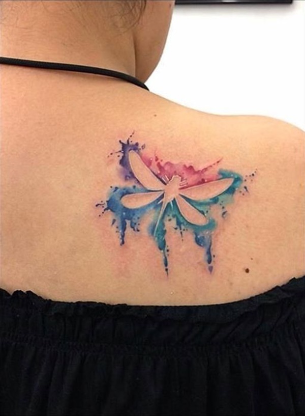 Watercolor outlined dragonfly tattoo on upper right back for women