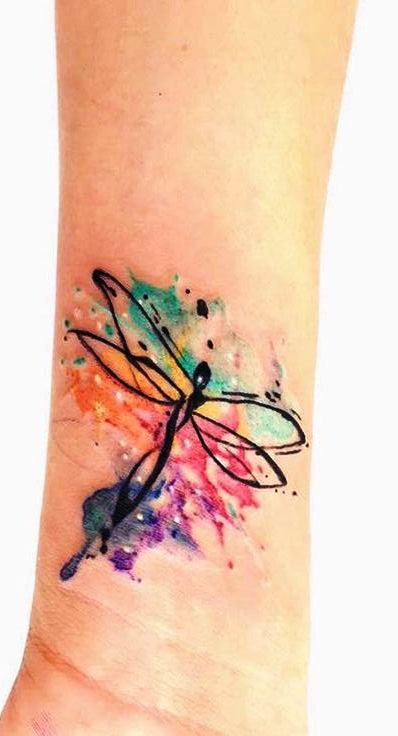 Wonderful watercolor dragonfly tattoo on wrist