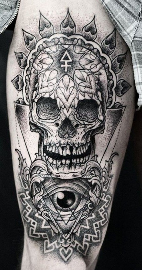 Black and grey skull with eye tattoo design on body