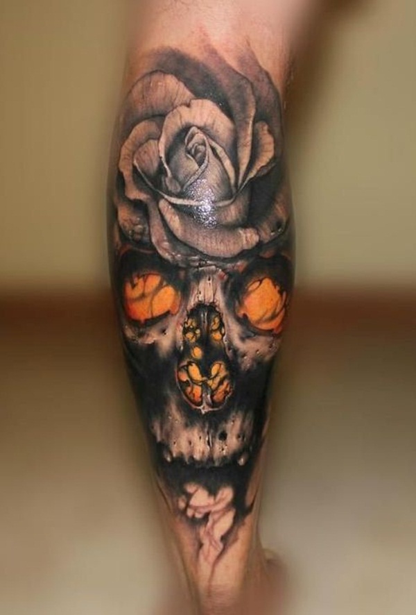 Black and mustard skull with rose tattoo on body