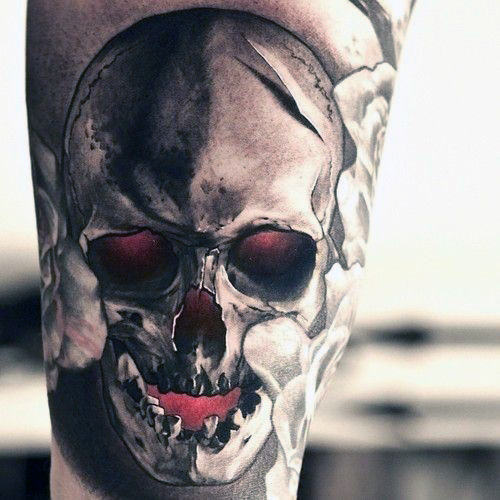 Black and red skull with colored holes tattoo on sleeve for men
