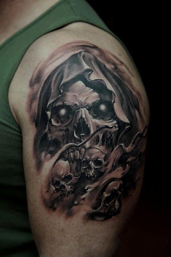 Black shaded grim reaper tattoo on upper arm for men