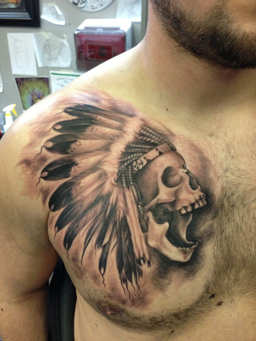 Black shaded Indian skull tattoo on upper right chest for men