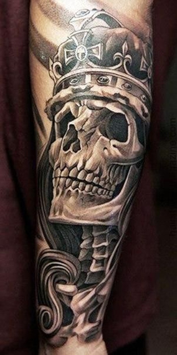 Black shaded skull with crown tattoo on sleeve