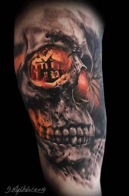 Black shaded skull with picture in eye sockets tattoo on upper arm for men