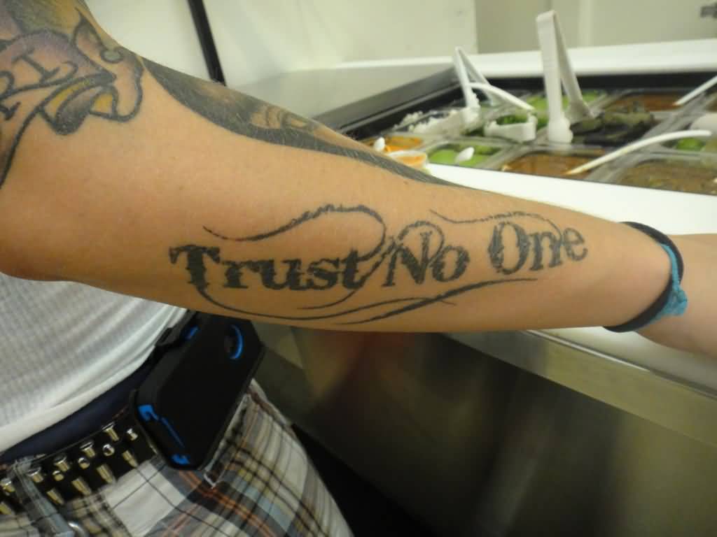 Black simple trust no one tattoo on forearm