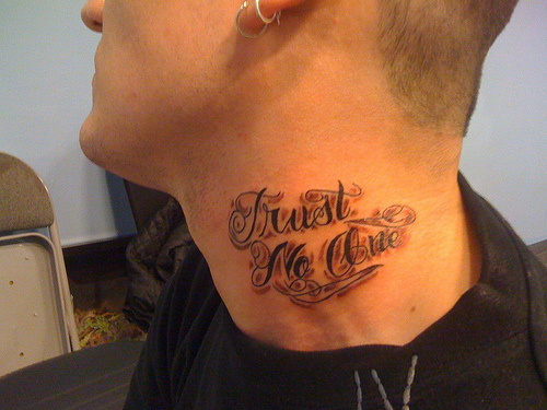 Black simple trust no one tattoo on neck for men