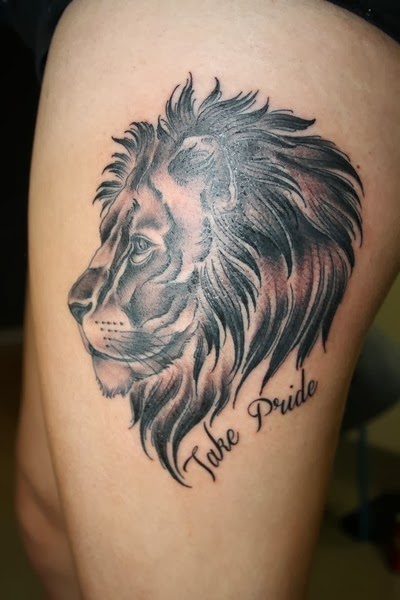 Black traditional lion tattoo on thigh for women