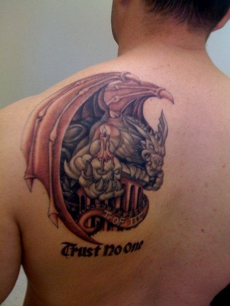 Colored dragon, skull and candle trust no one tattoo on upper left back