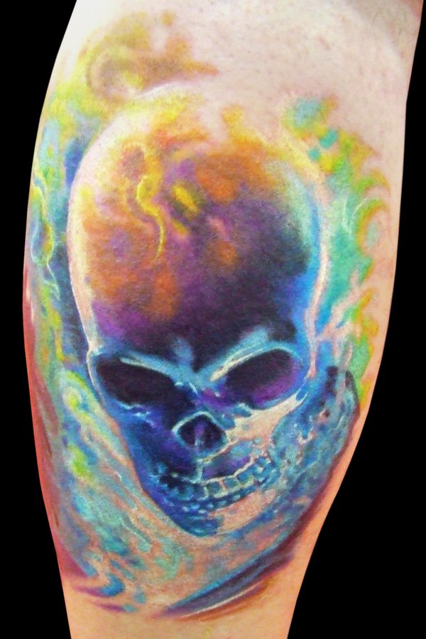 Colored skull tattoo on arm by maximo lutz
