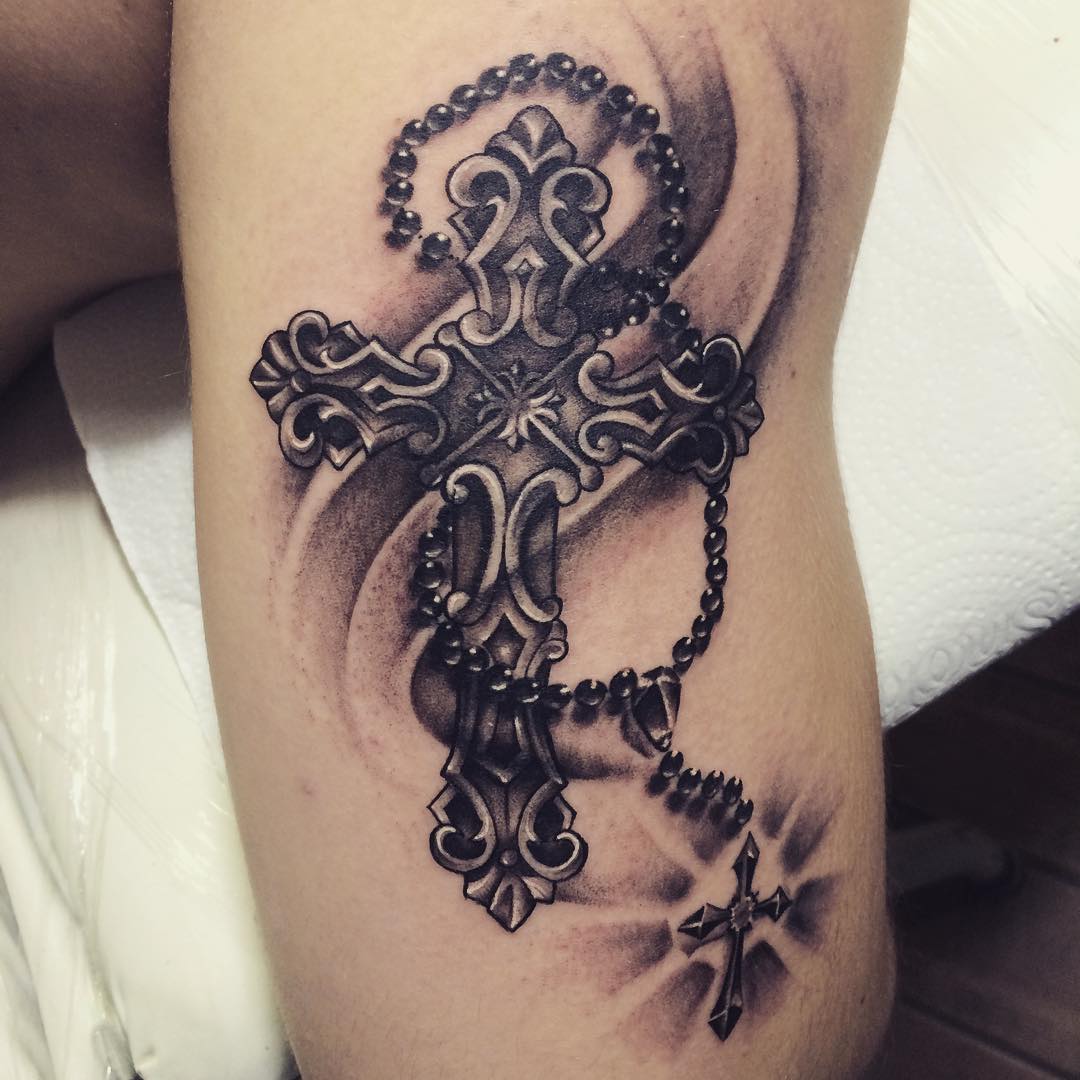Grey and black shaded cross chain with cross tattoo on body