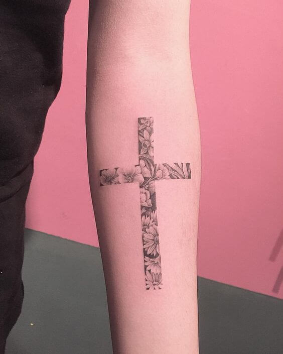 Grey floral cross tattoo design for girl’s forearm