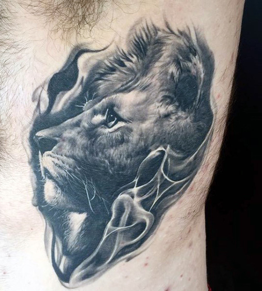 Grey lion tattoo on left chest for men