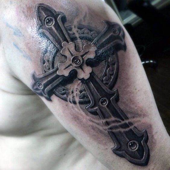 Grey shaded 3d cross tattoo design on upper arm for men