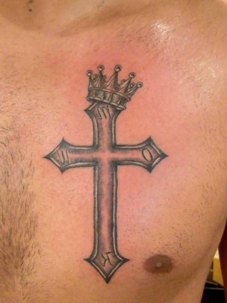 Grey shaded cross with crown tattoo on left upper chest for men