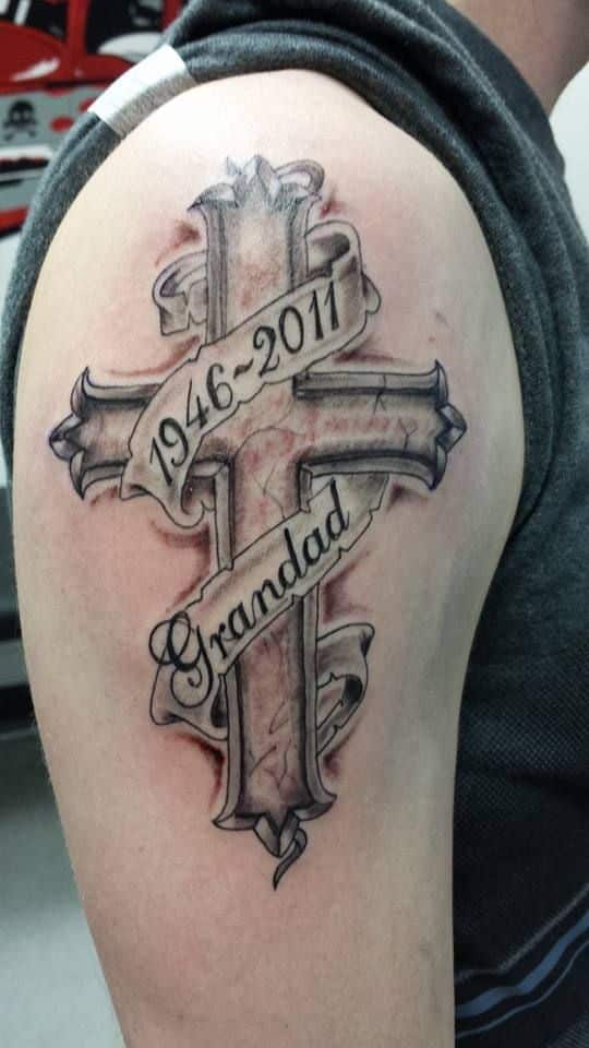 Grey shaded grandad memorial cross tattoo on men upper sleeve