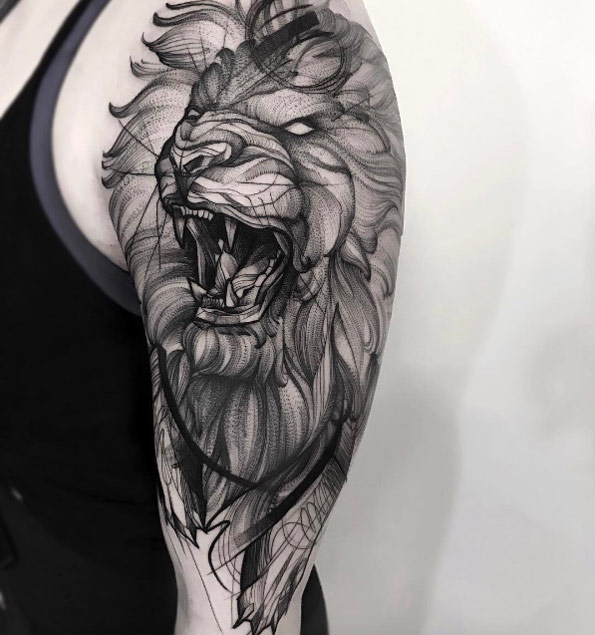 Grey sketched roaring lion tattoo on left upper sleeve