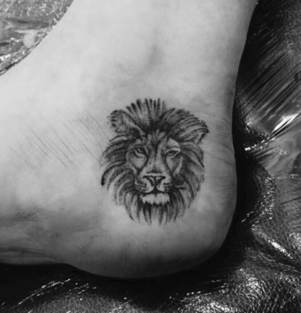Small cute lion tattoo on girl foot heel