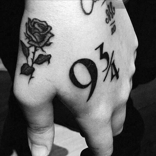 Black and grey rose and maths tattoo on upper right hand