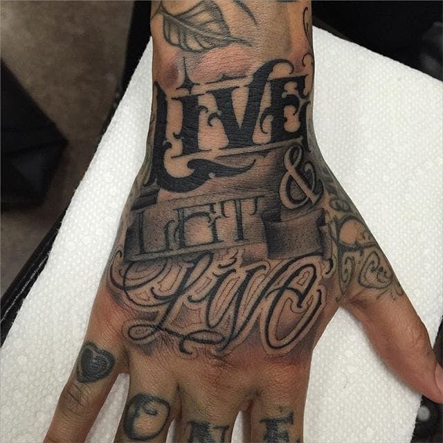 Black live and let live tattoo on upper right hand